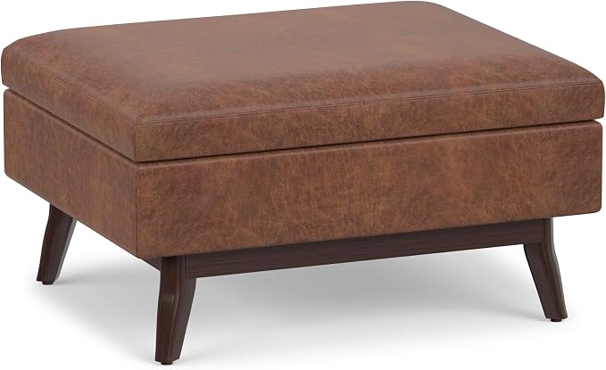 SIMPLIHOME Owen Coffee Table Storage Ottoman - 34" Wide x 19" High Upholstered Vegan Leather Rectangular Lift-Top Ottoman in Distressed Saddle Brown, Mid-Century Modern Bench with Tapered Legs
