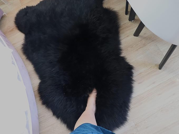 Woolous Black Sheepskin Rug Genuine New Zealand Lambskin Single Pelt 2x3 ft | Real New Zealand lambskin wool with soft fluffy texture. Use as sheep skin rug, chair throw, sofa cover or bedroom decor.