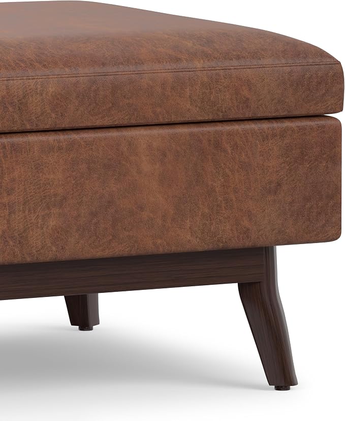 SIMPLIHOME Owen Coffee Table Storage Ottoman - 34" Wide x 19" High Upholstered Vegan Leather Rectangular Lift-Top Ottoman in Distressed Saddle Brown, Mid-Century Modern Bench with Tapered Legs